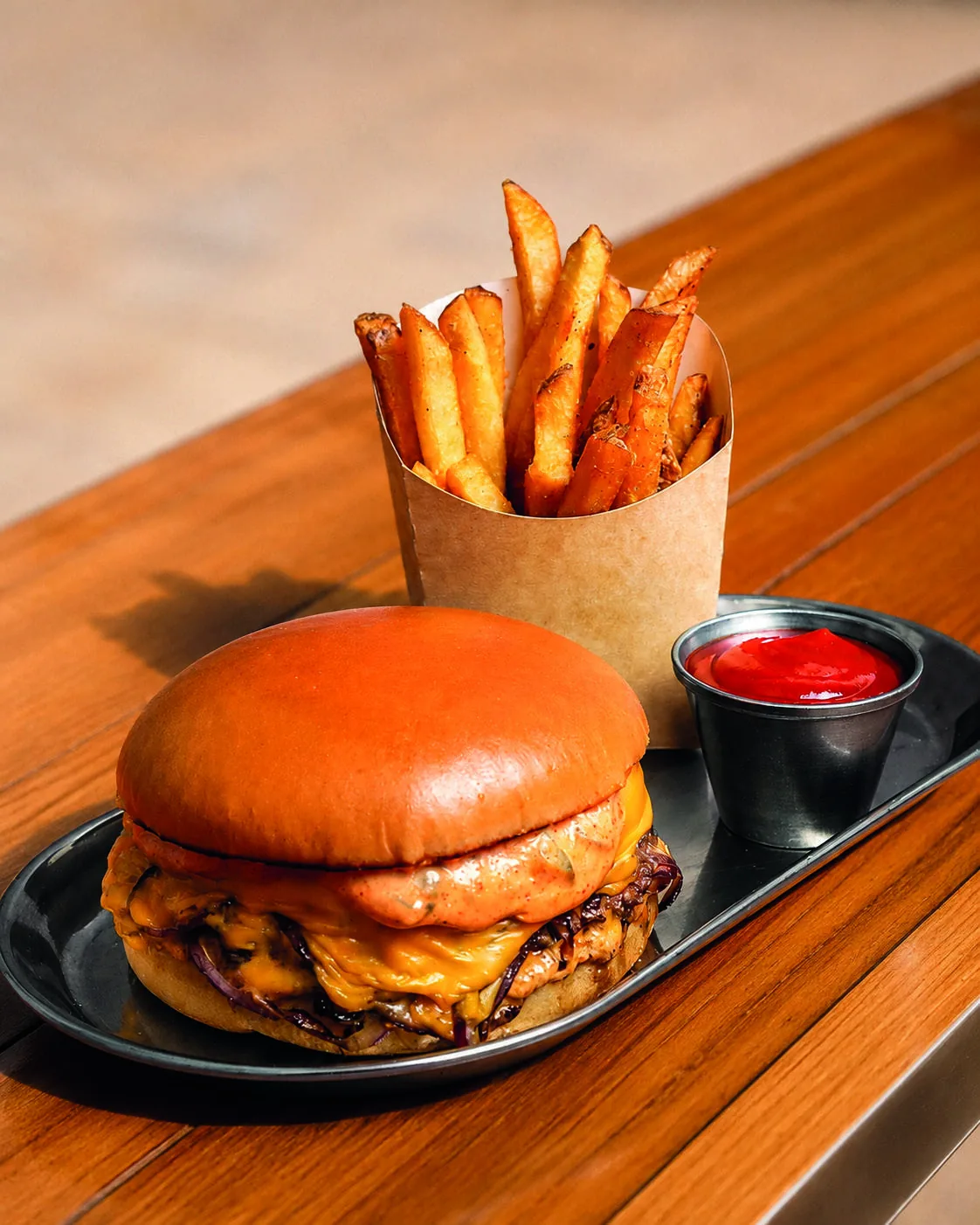Smash cheeseburger with fries at Cult Space